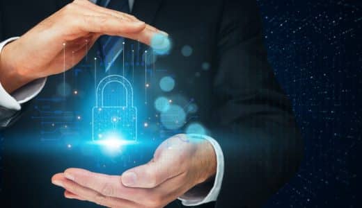 Protecting,Your,Digital,Assets:,A,Businessman’s,Hands,Gently,Cradle,A
