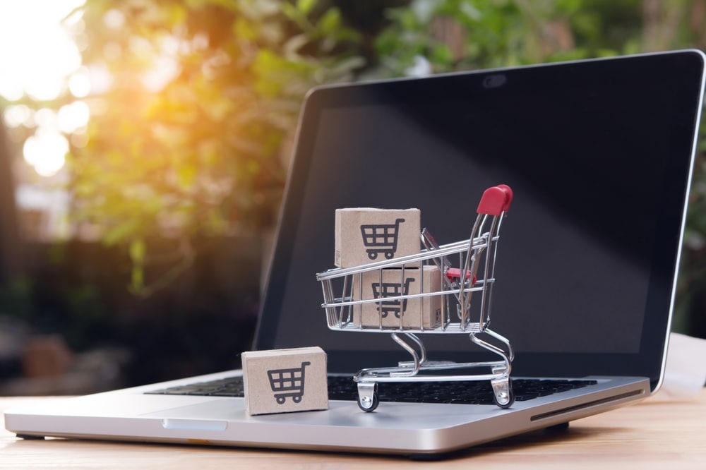 Shopping,Online.,Cardboard,Box,With,A,Shopping,Cart,Logo,In